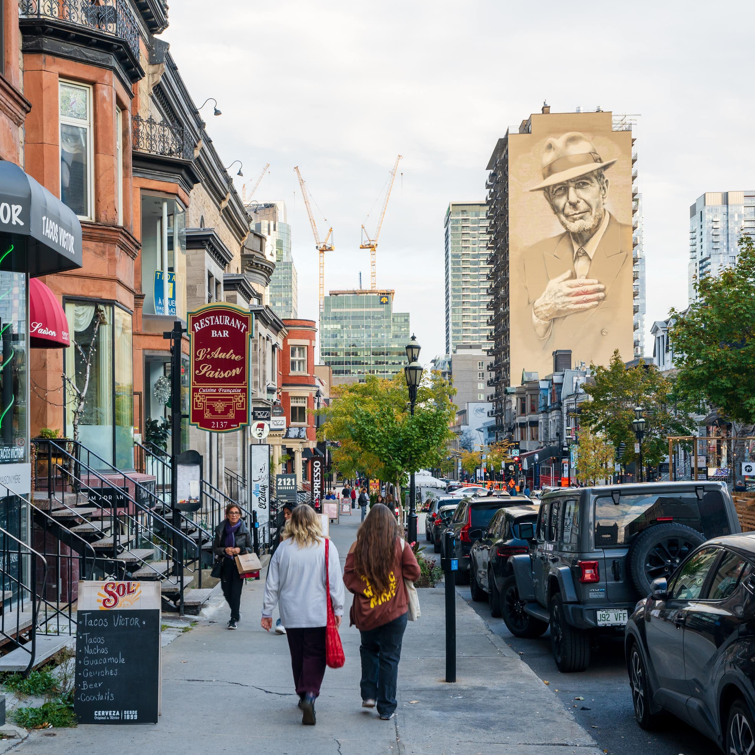 People walking on the sidewalk in the city center