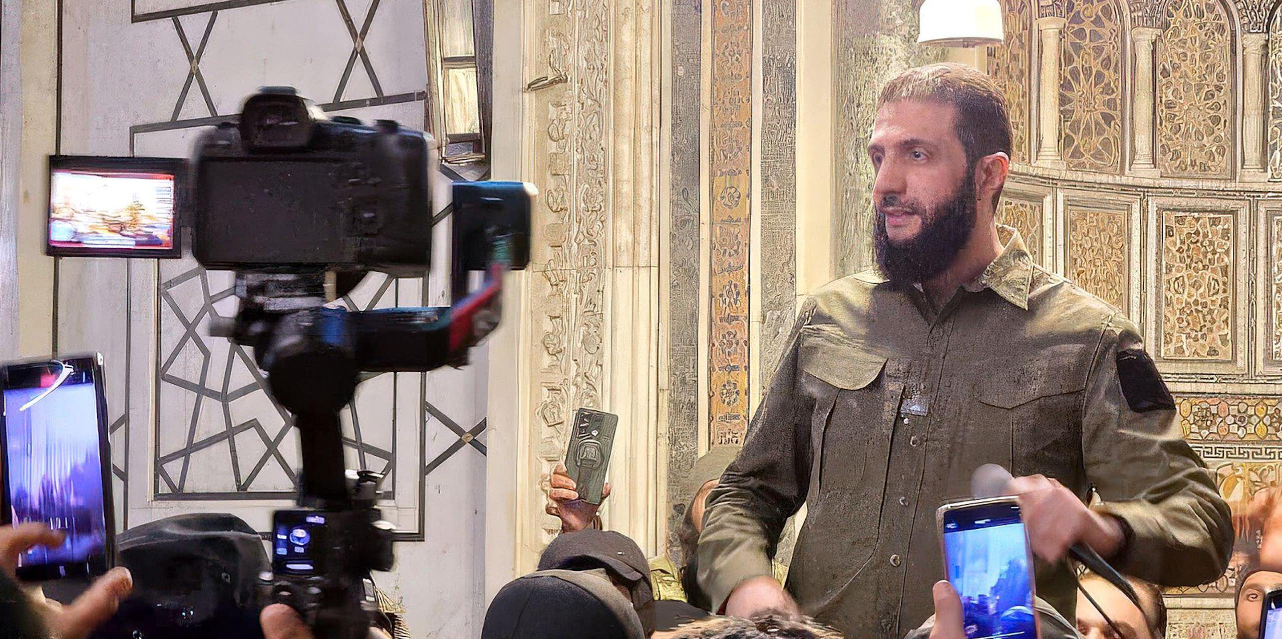 HTS leader Ahmed Al-Shara, also known as Abu Muhammad Al-Jolani talks to the press, December 2024.
