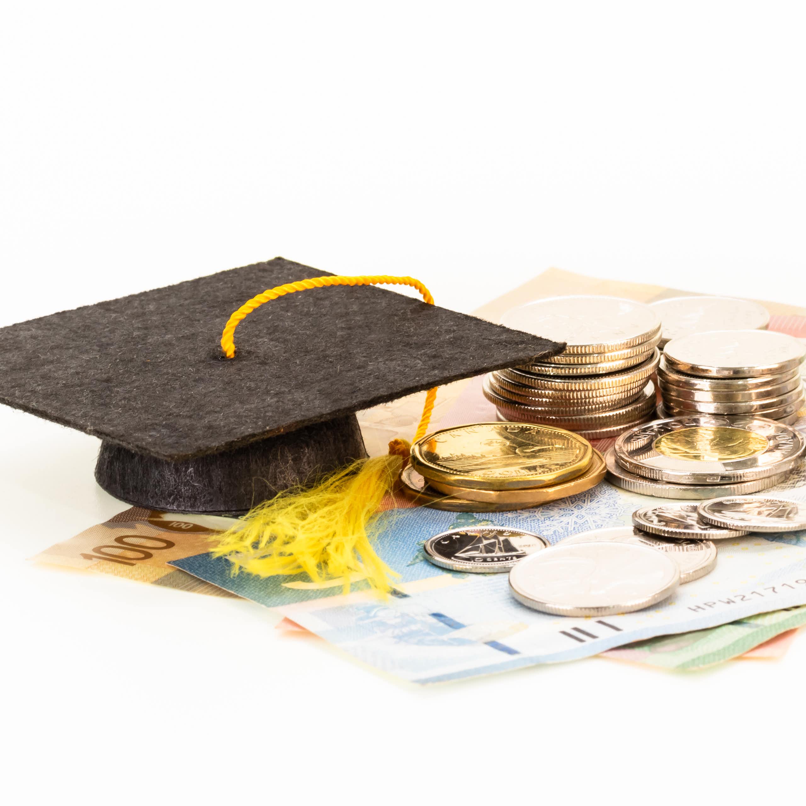 A graduation cap and money.