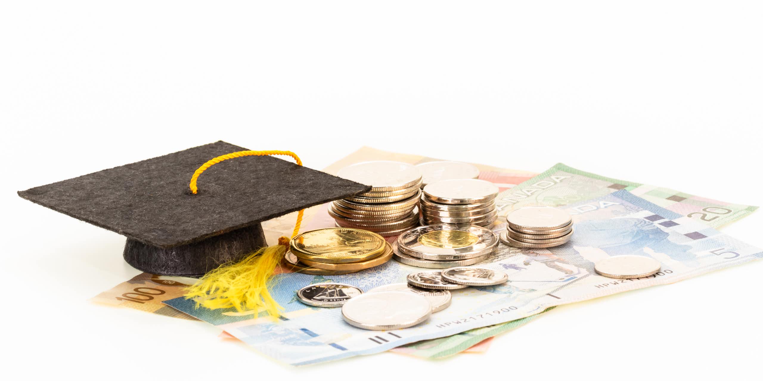 A graduation cap and money.