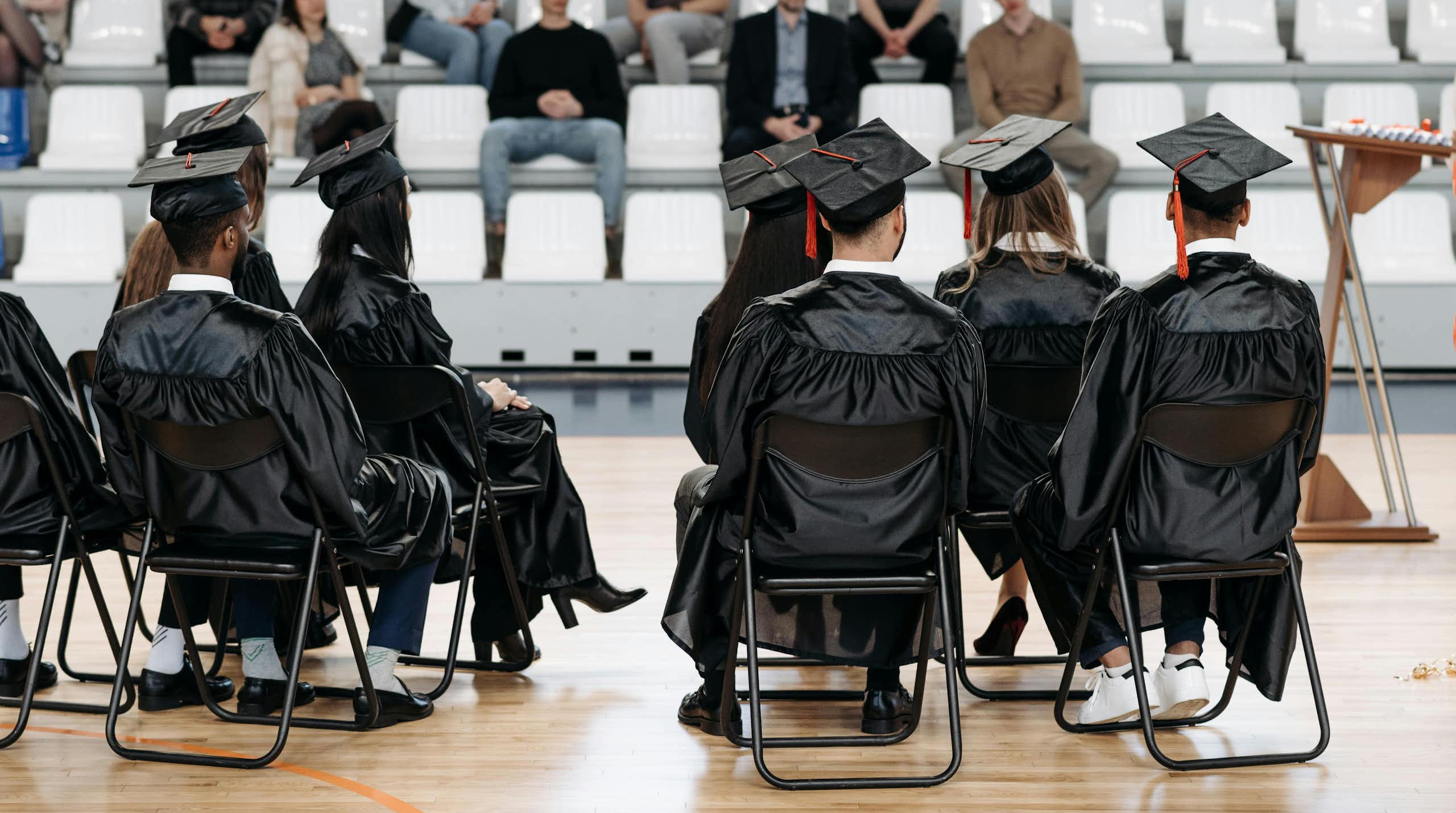 Graduates on a stage.