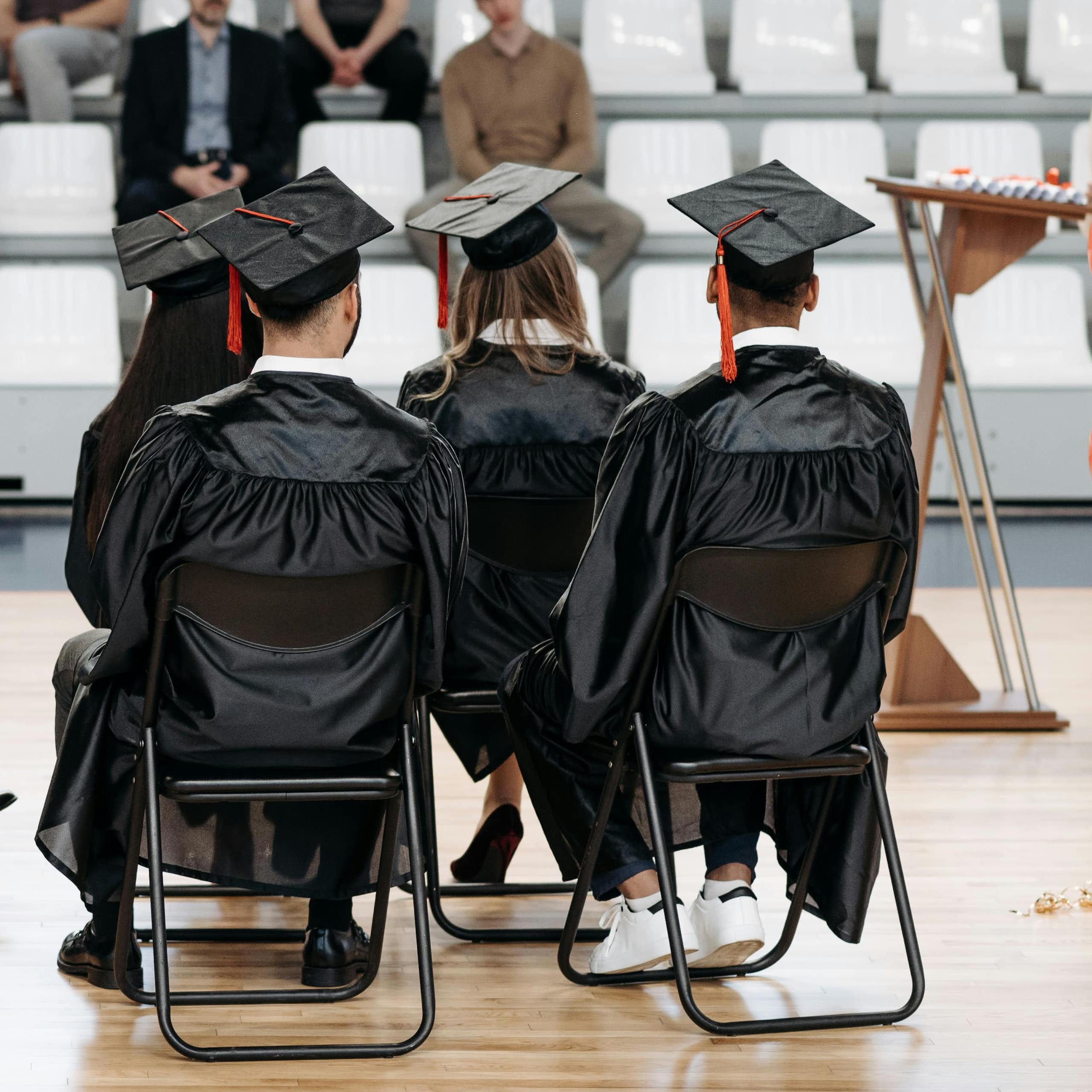 Graduates on a stage.