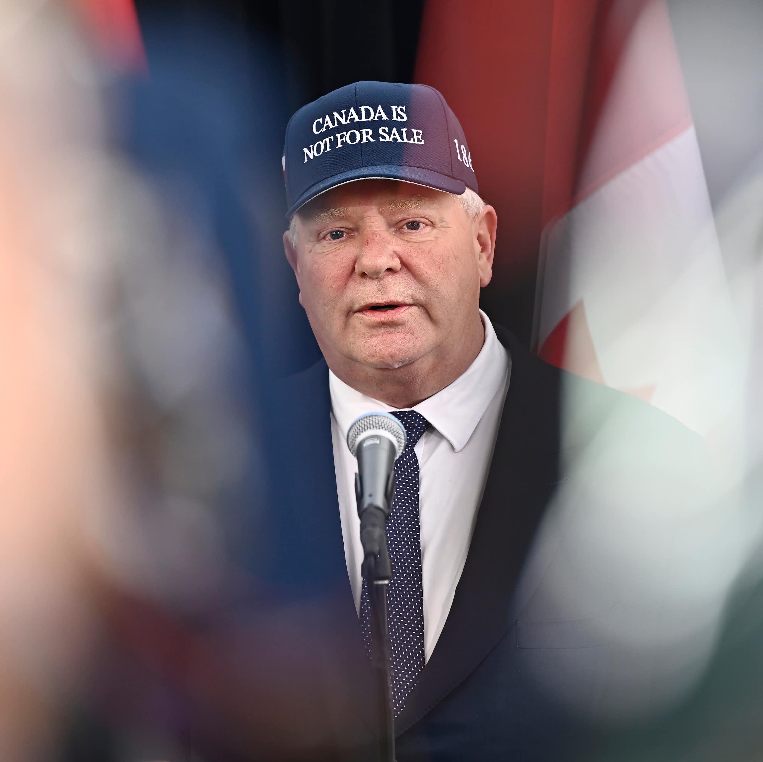 A man wearing a Canada is Not For Sale ball cap.