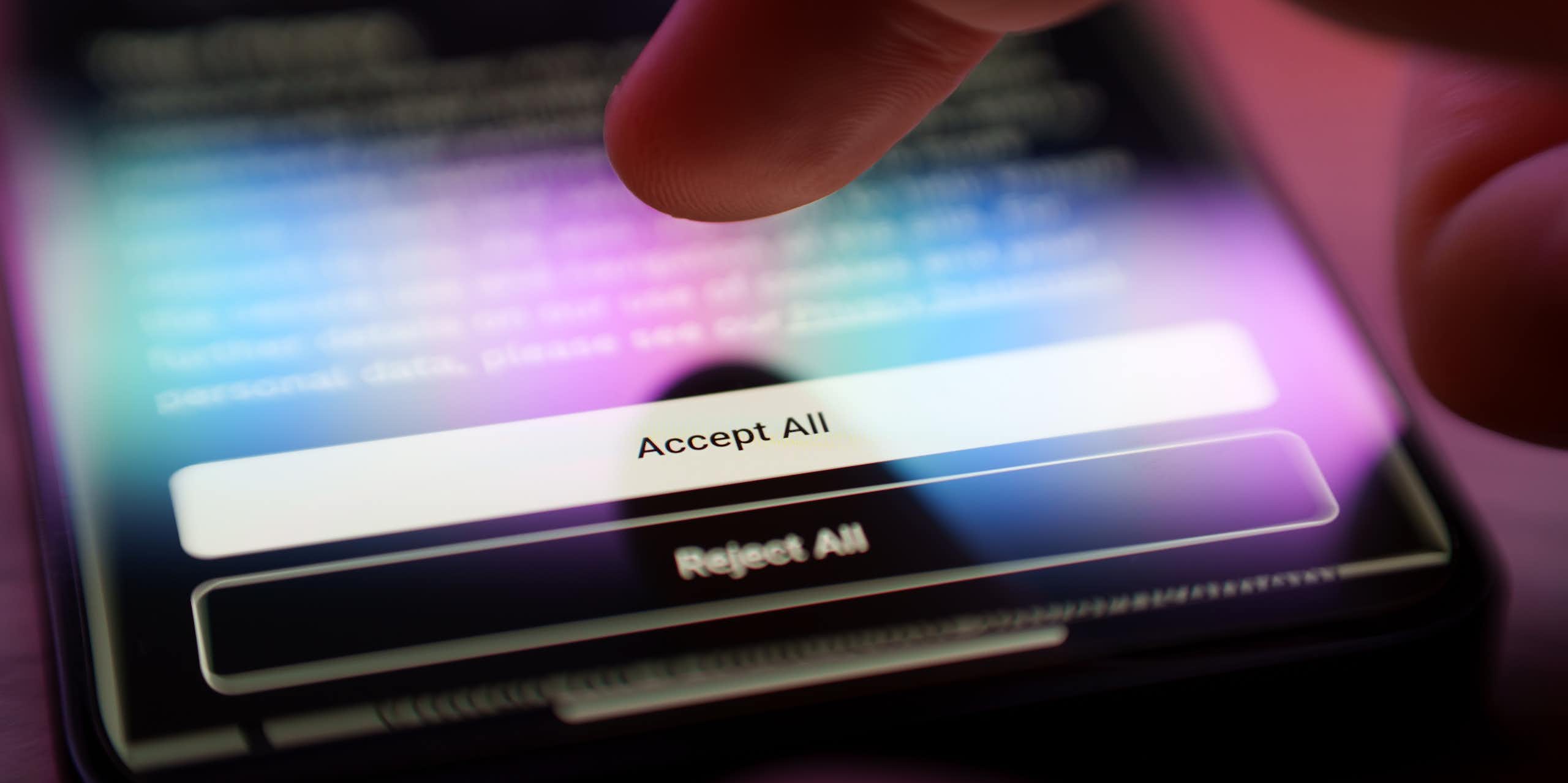 Finger about to press 'Accept All Cookies' button on a privacy policy. 