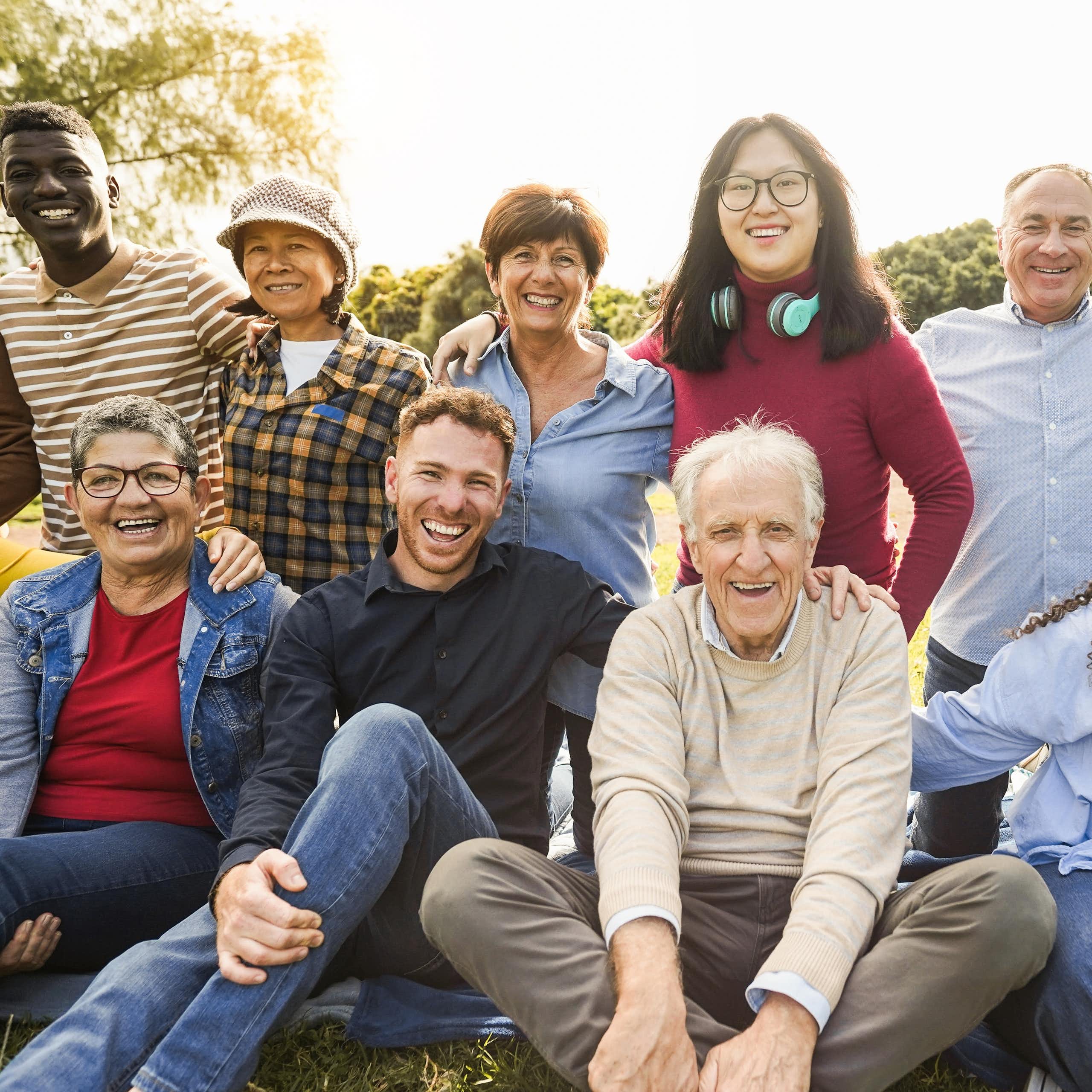 A group of people or varying ages in an outdoor setting